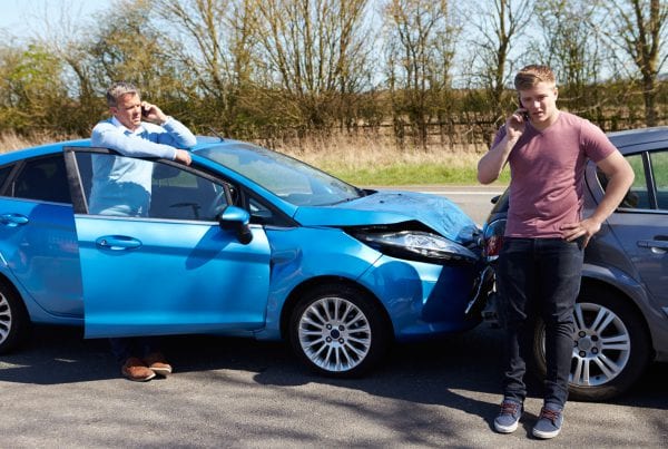 drivers Making Phone Call After Traffic Accident